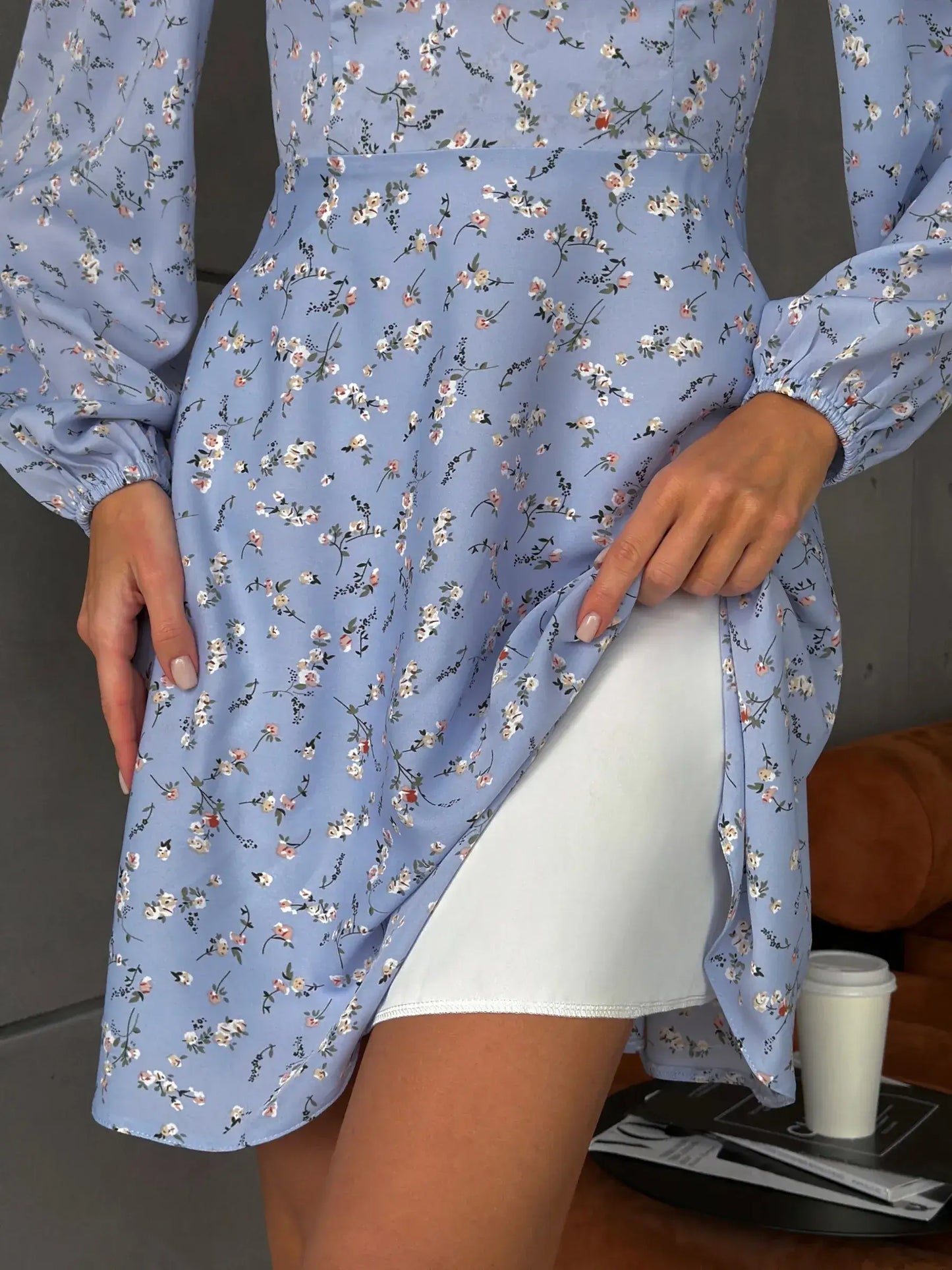 Bloom Belle sky blue mini dress featuring floral patterns and a flowy silhouette, ideal for summer and formal occasions.