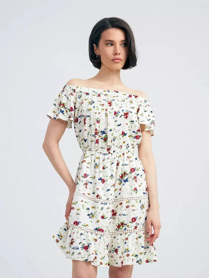 Bloom Off-Shoulder summer dress featuring multicolor floral print and embroidered trims, ideal for effortless elegance.