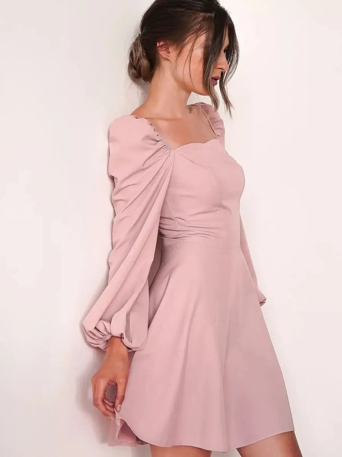 Blush Aura mini dress with puff sleeves and square neckline, perfect for weddings and formal occasions.