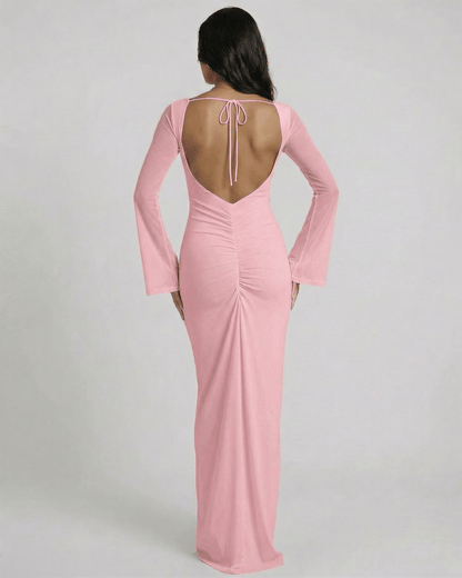 Back view of Lauven Blush Maxi Dress with open back and long sleeves in soft pink.