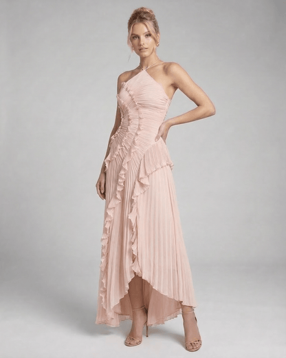 Blush Maxi Dress by Lauven - Soft pink pleated halter neck gown with elegant ruffle details and flowing silhouette.