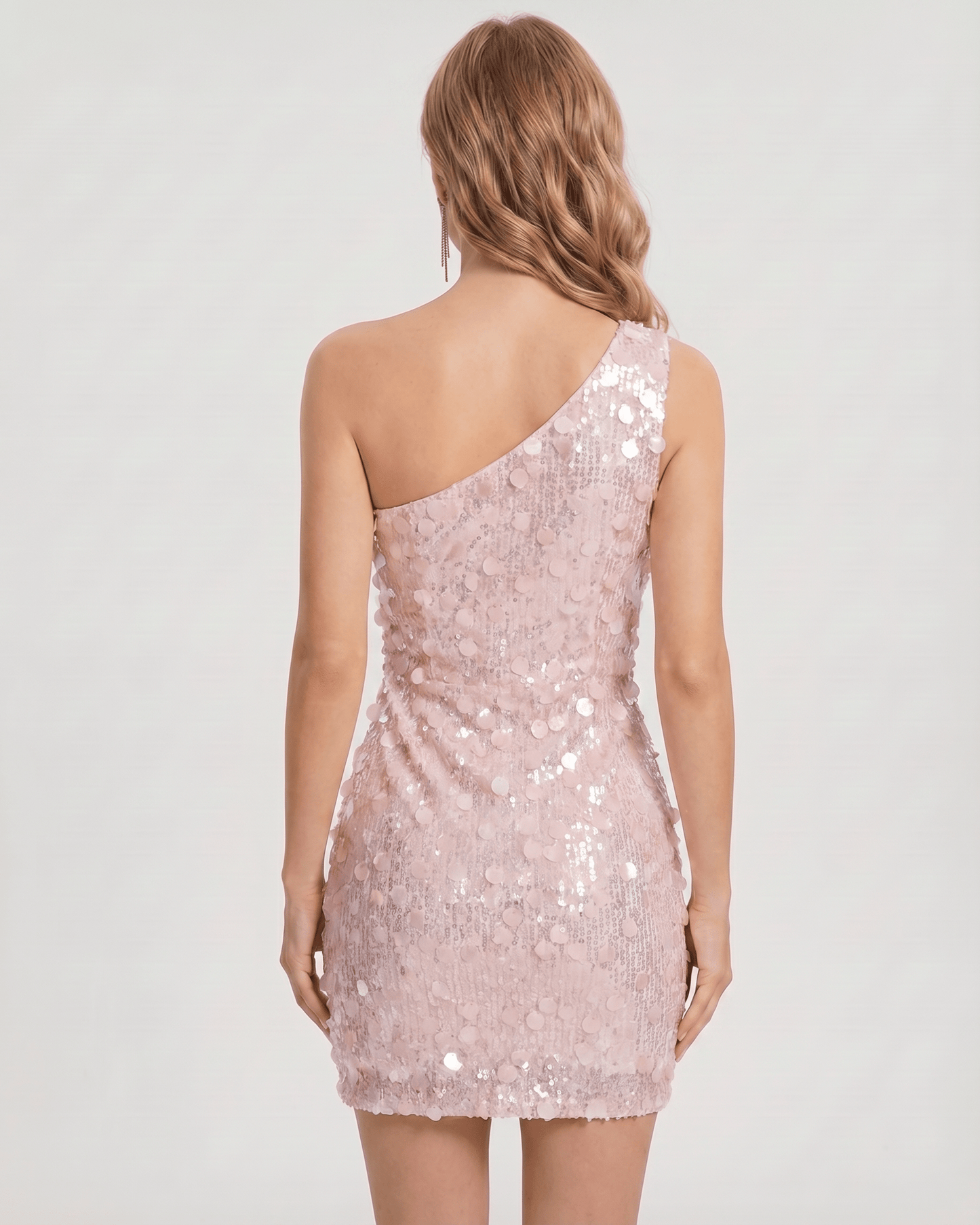 Blush pink bodycon mini dress featuring one shoulder design, shimmering sequin embellishments, perfect for evening events by Lauven.