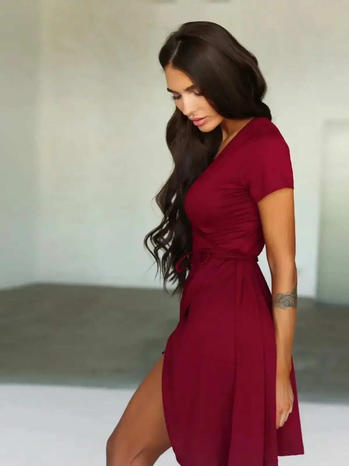 Chic burgundy wrap mini dress with short sleeves, perfect for summer occasions and casual wear.