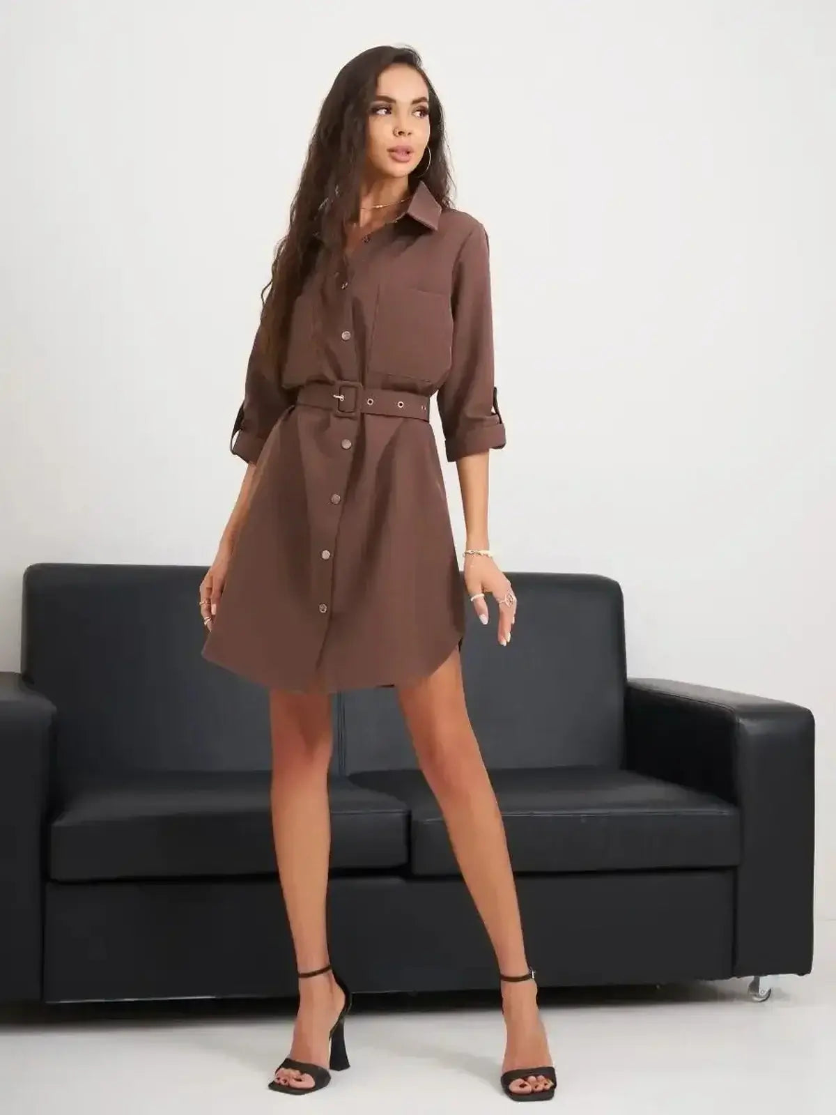 Chic brown mini dress with button-down front and belted waist, perfect for summer styling and special occasions.