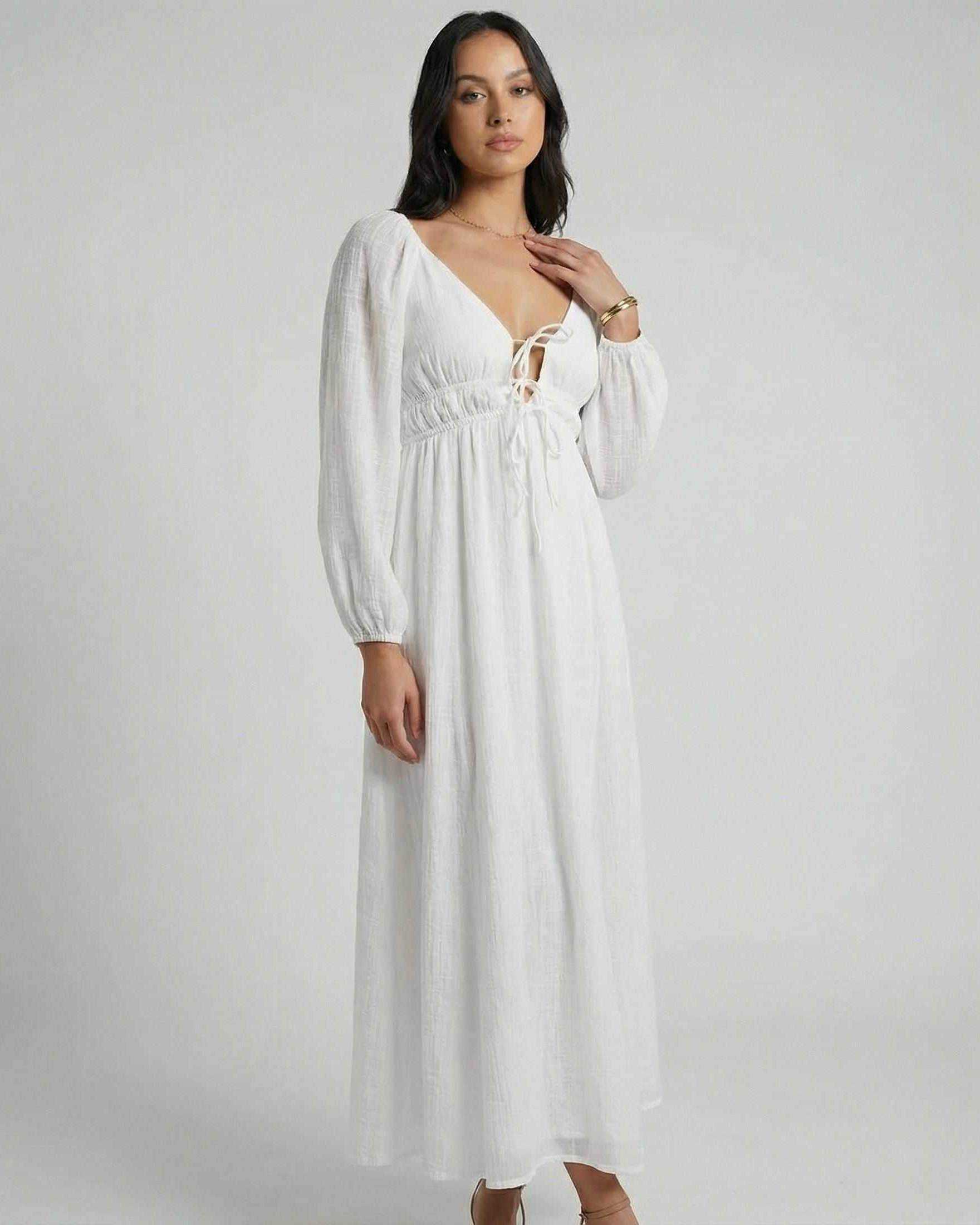 Calista Maxi Dress by Lauven, elegant white maxi dress with V-neck and long puff sleeves.