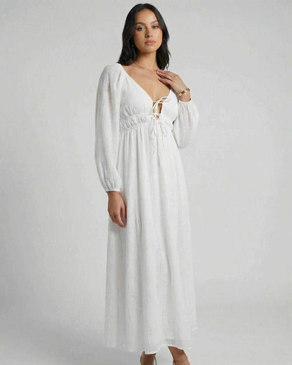 Calista Maxi Dress by Lauven, elegant white maxi dress with V-neck and long puff sleeves.