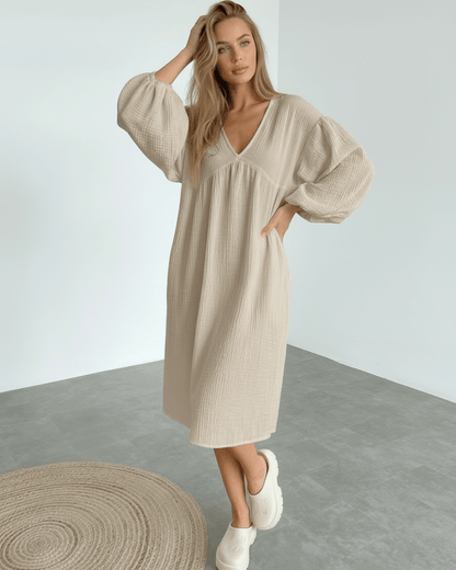 Calista Midi Dress in beige cotton with puff sleeves, offering modern minimalism and everyday elegance by Lauven.