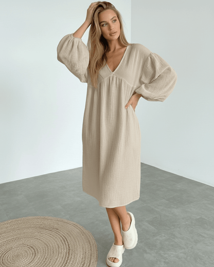 Calista Midi Dress in beige cotton with puff sleeves, modern minimalism and everyday elegance by Lauven.