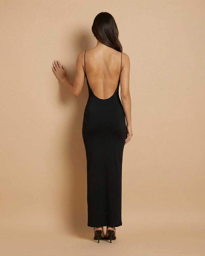 Back view of the Calypso Maxi Dress by Lauven, showcasing its backless silhouette and sleek black design.