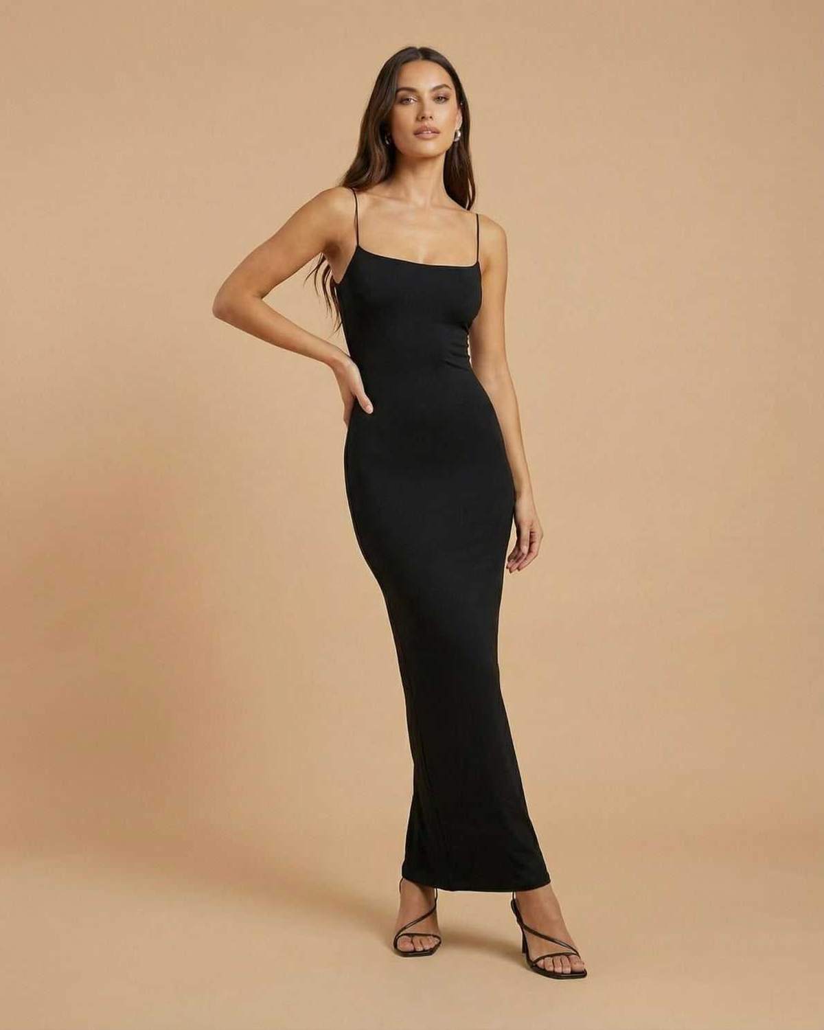 Calypso Maxi Dress by Lauven - Elegant black backless maxi dress with slender spaghetti straps and a fitted silhouette.
