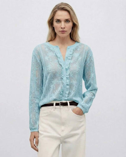 Lauven Capri Blouse featuring a light blue long sleeve jacquard knit design with button front and feminine details.