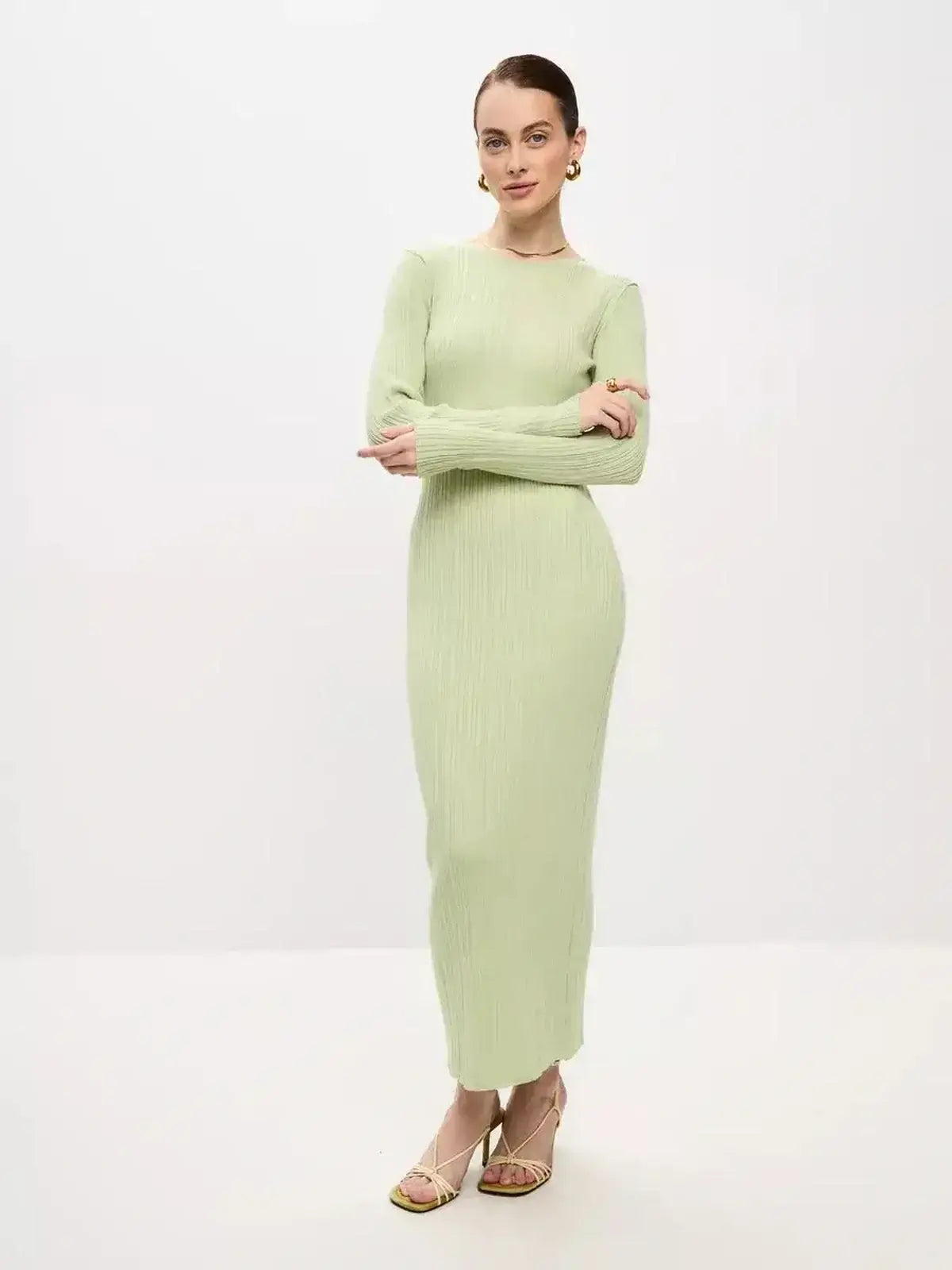Celery Luxe Maxi Dress by Lauven, showcasing a light green ribbed silhouette with long sleeves and a seamless fit.