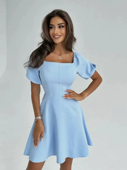 Celeste Charm Mini Dress in light blue with puff sleeves, perfect for summer parties and wedding guest attire.