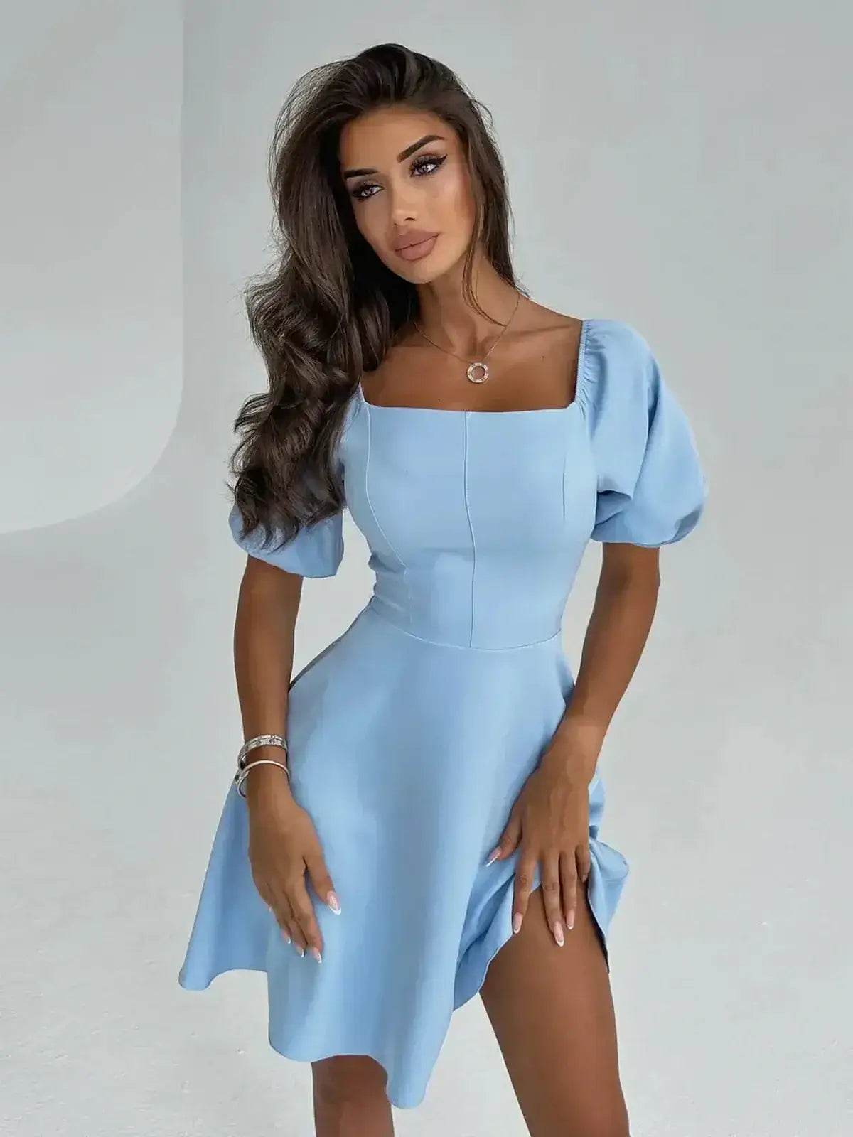 Celeste Charm Mini Dress in light blue with puff sleeves, perfect summer dress for weddings and casual events.