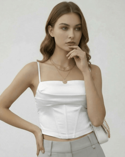 Celeste Corset Top by Lauven in white satin, showcasing structured elegance and sleek silhouette.