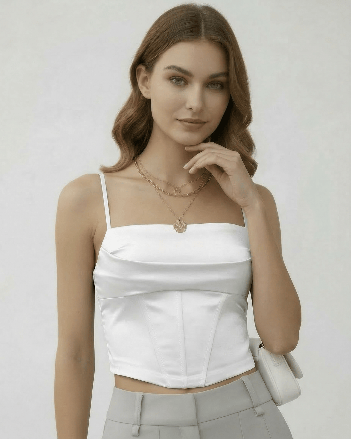 Celeste Corset Top by Lauven in refined white satin, showcasing structured elegance and a tailored silhouette.