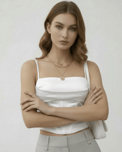 Celeste Corset Top by Lauven, elegant white satin sleeveless corset top for a refined silhouette.