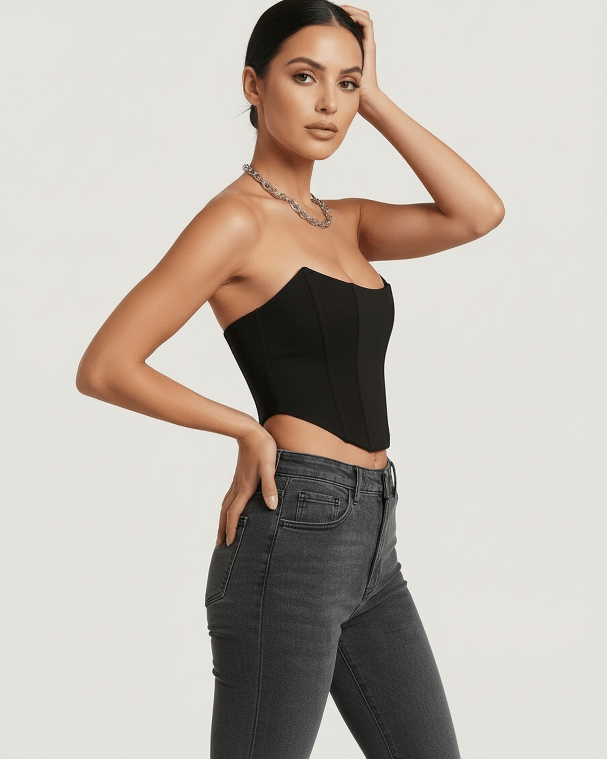 Elegant model wearing a black Celeste Corset Top by Lauven, showcasing its structured silhouette and luxe design.