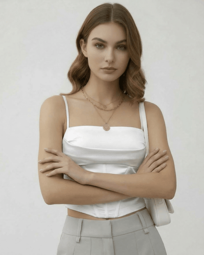 Celeste Corset Top by Lauven, showcasing a refined white satin design with structured elegance in a modern style.