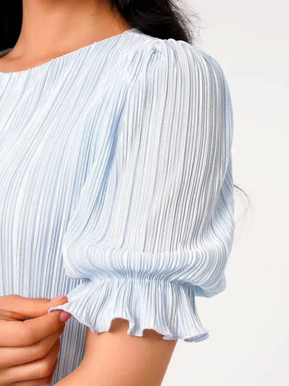 Close-up of puff sleeve on Celeste Flow Maxi Dress, featuring light blue pleated fabric and delicate ruffle detail.