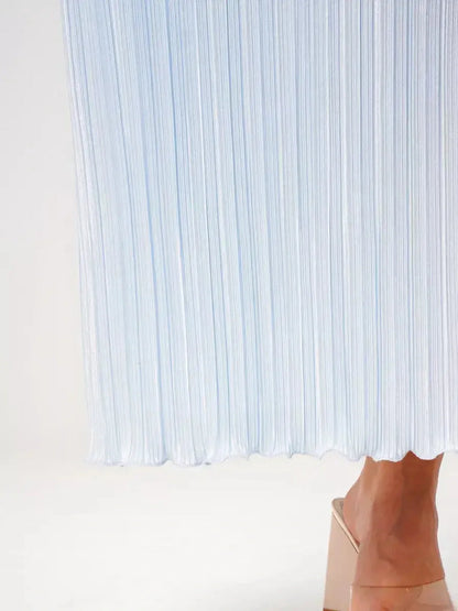 Light blue pleated fabric of the Celeste Flow Maxi Dress, showcasing elegant drape and delicate styling.