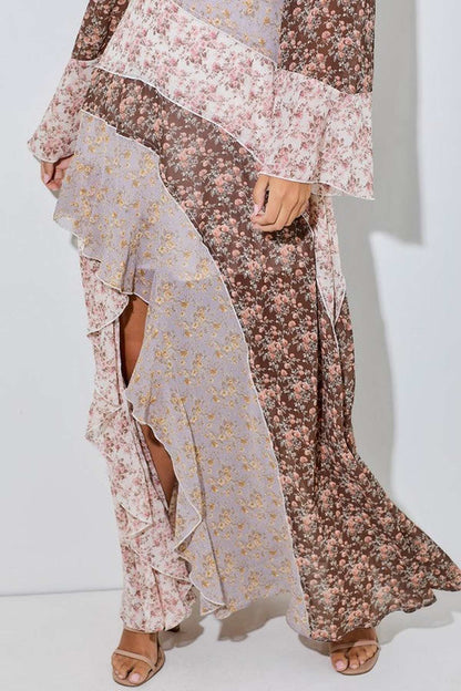 Celeste maxi dress featuring a floral patchwork design, ruffle trim, and asymmetrical hem for bohemian elegance.