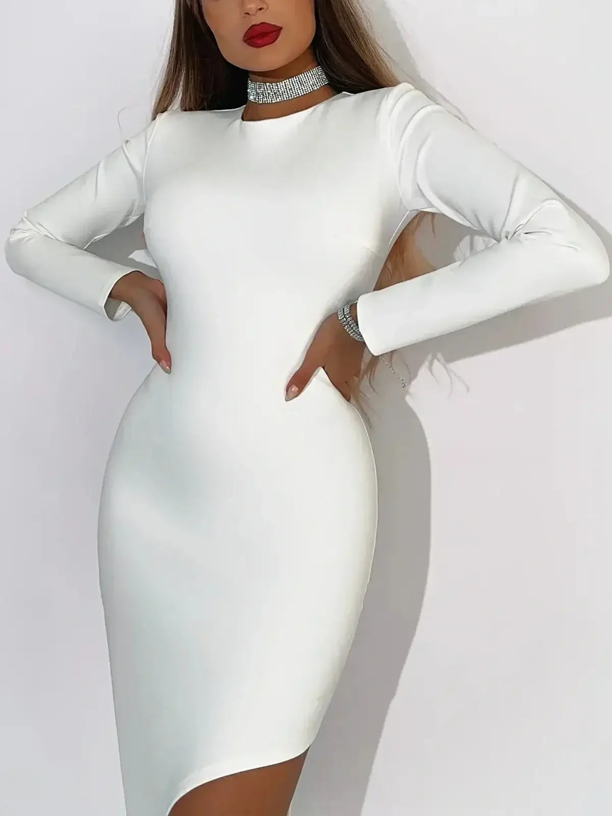 Model showcasing the Celeste Maxi Dress in creamy white fabric with asymmetric hemline and elegant silhouette.