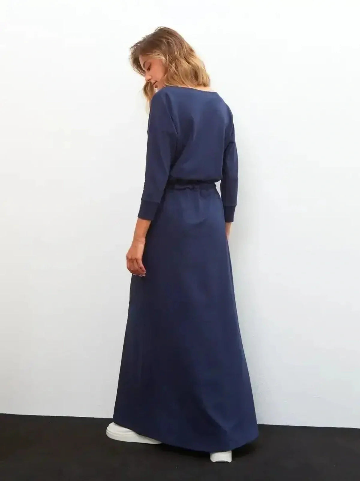 Elegant navy Celeste maxi dress with long sleeves and a relaxed fit, perfect for versatile women's clothing styles.
