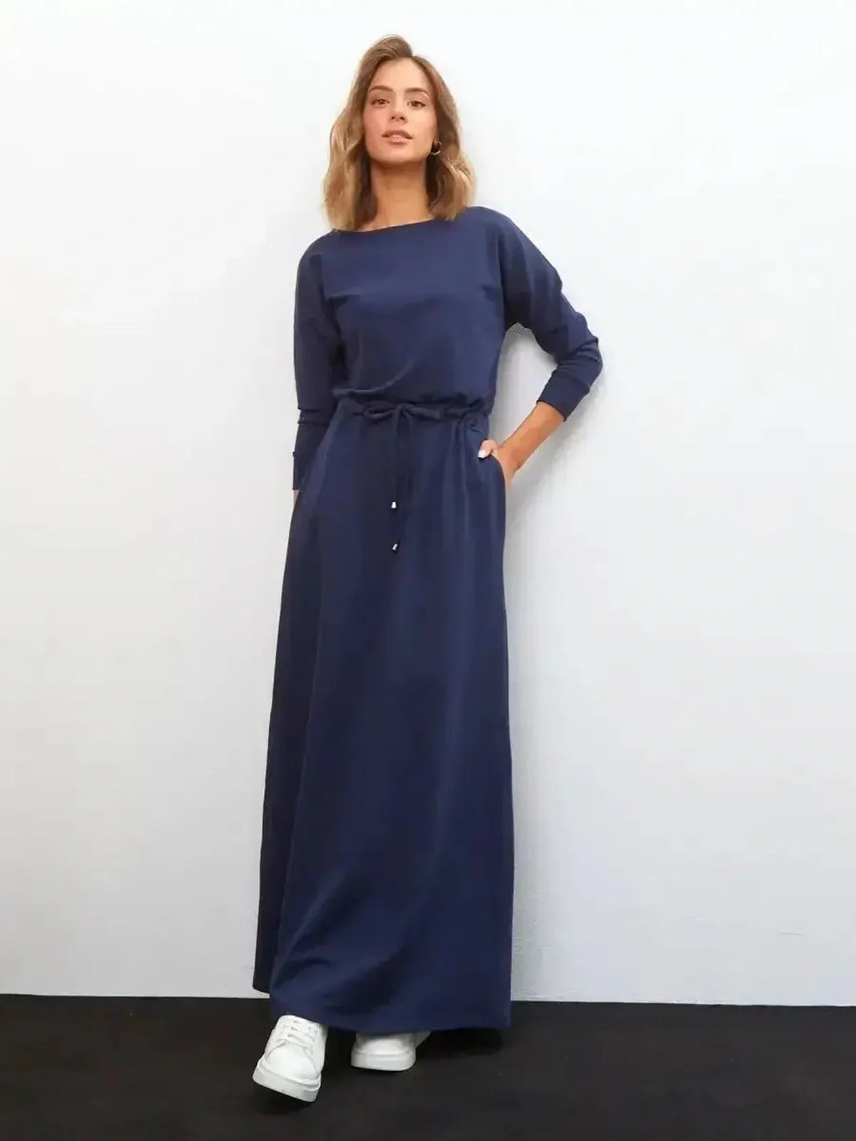 Elegant navy Celeste Maxi Dress featuring long sleeves and a relaxed fit, perfect for summer and formal occasions.