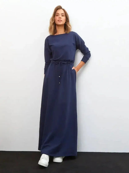 Elegant navy Celeste Maxi Dress featuring long sleeves and a relaxed fit, perfect for summer and formal occasions.