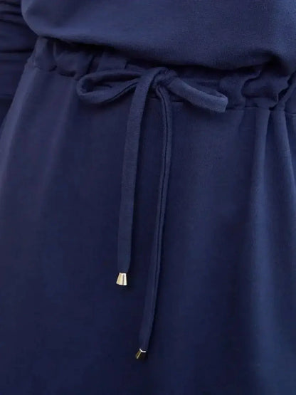 Close-up of the Celeste Maxi Dress waist tie detail in elegant navy fabric, ideal for summer dresses and wedding guest attire.