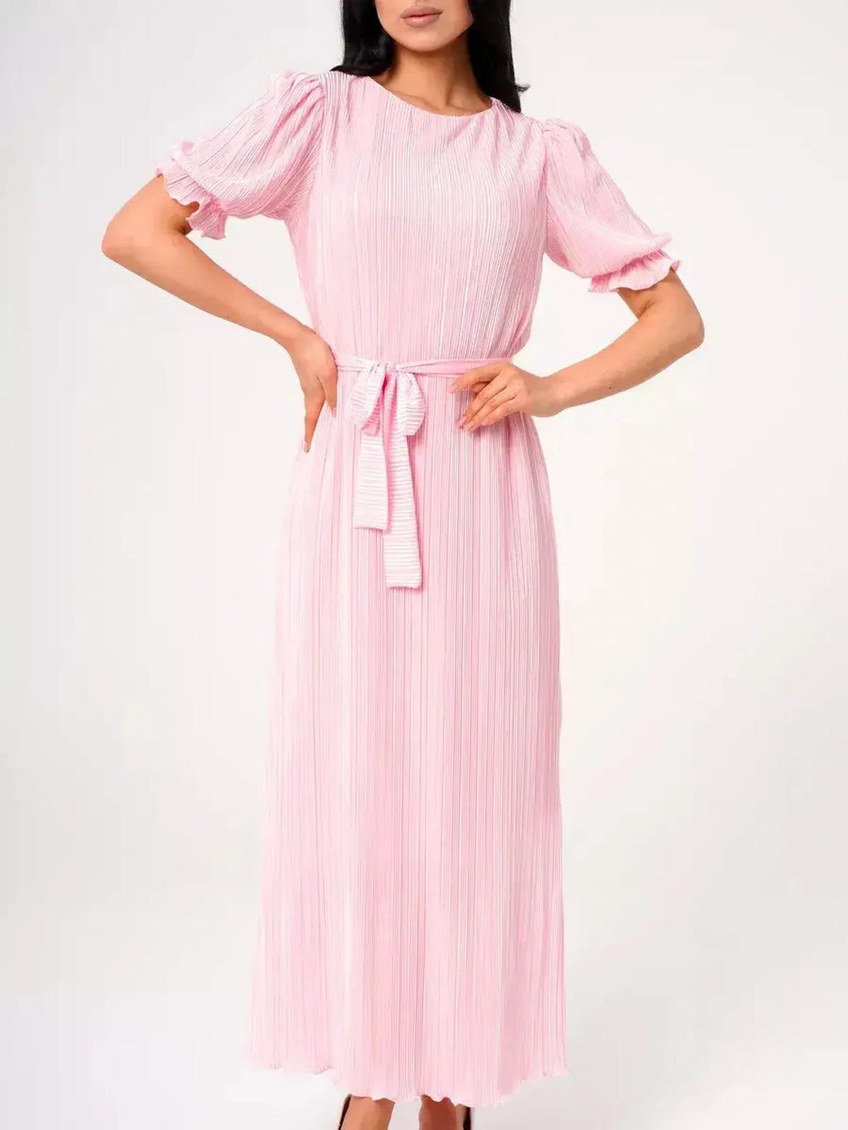 Celeste Maxi Dress in pink, featuring pleated fabric, puff sleeves, and a tie waist, perfect for summer and formal occasions.