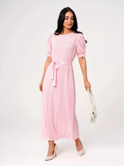 Celeste Maxi Dress in pink, featuring puff sleeves and a tie waist, perfect for summer weddings and formal occasions.