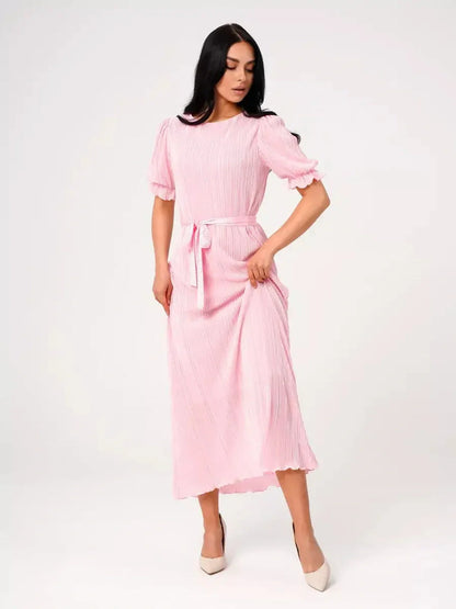 Celeste Maxi Dress in pink, featuring pleated design, puff sleeves, and a tie waist, perfect for summer and wedding guest occasions.