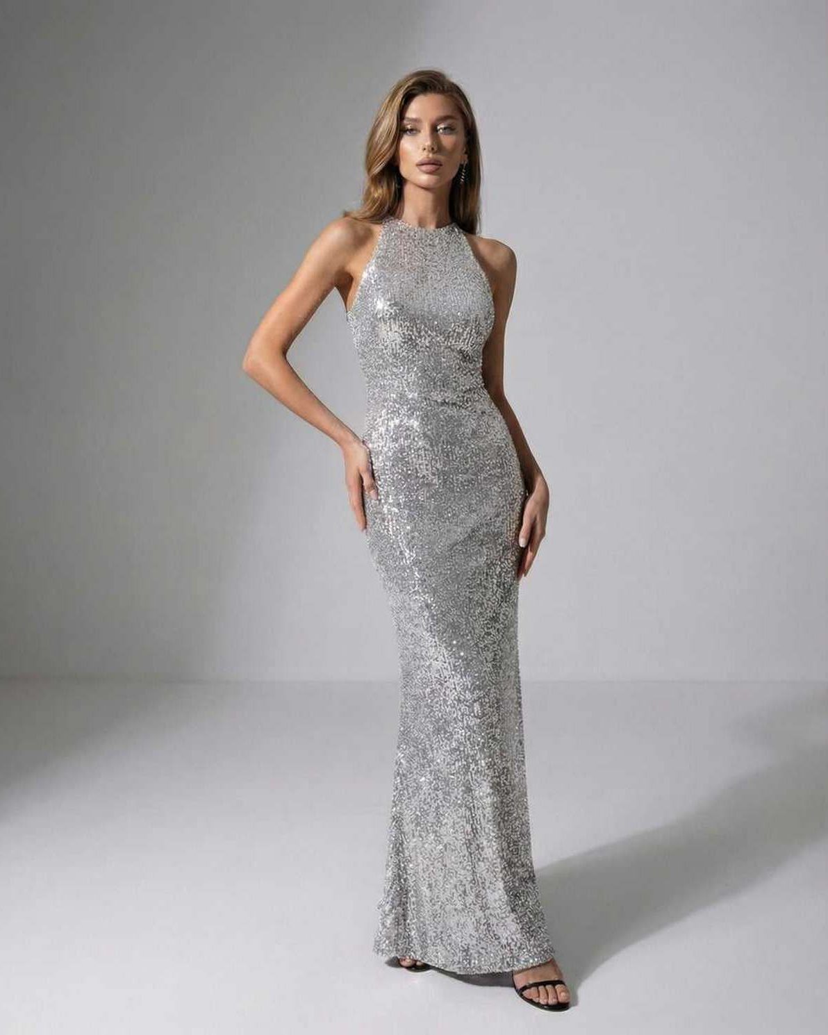 Celeste Maxi Dress - Silver sequin halter neck evening gown by Lauven, exuding elegance and a polished look.