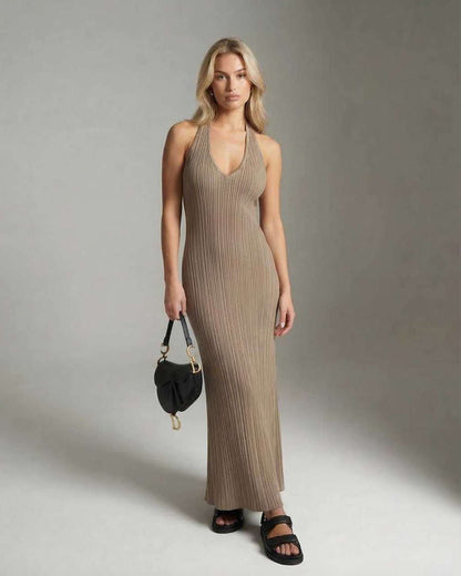 Model wearing the Celeste Maxi Dress by Lauven, showcasing a sleek ribbed knit design in a neutral tone.