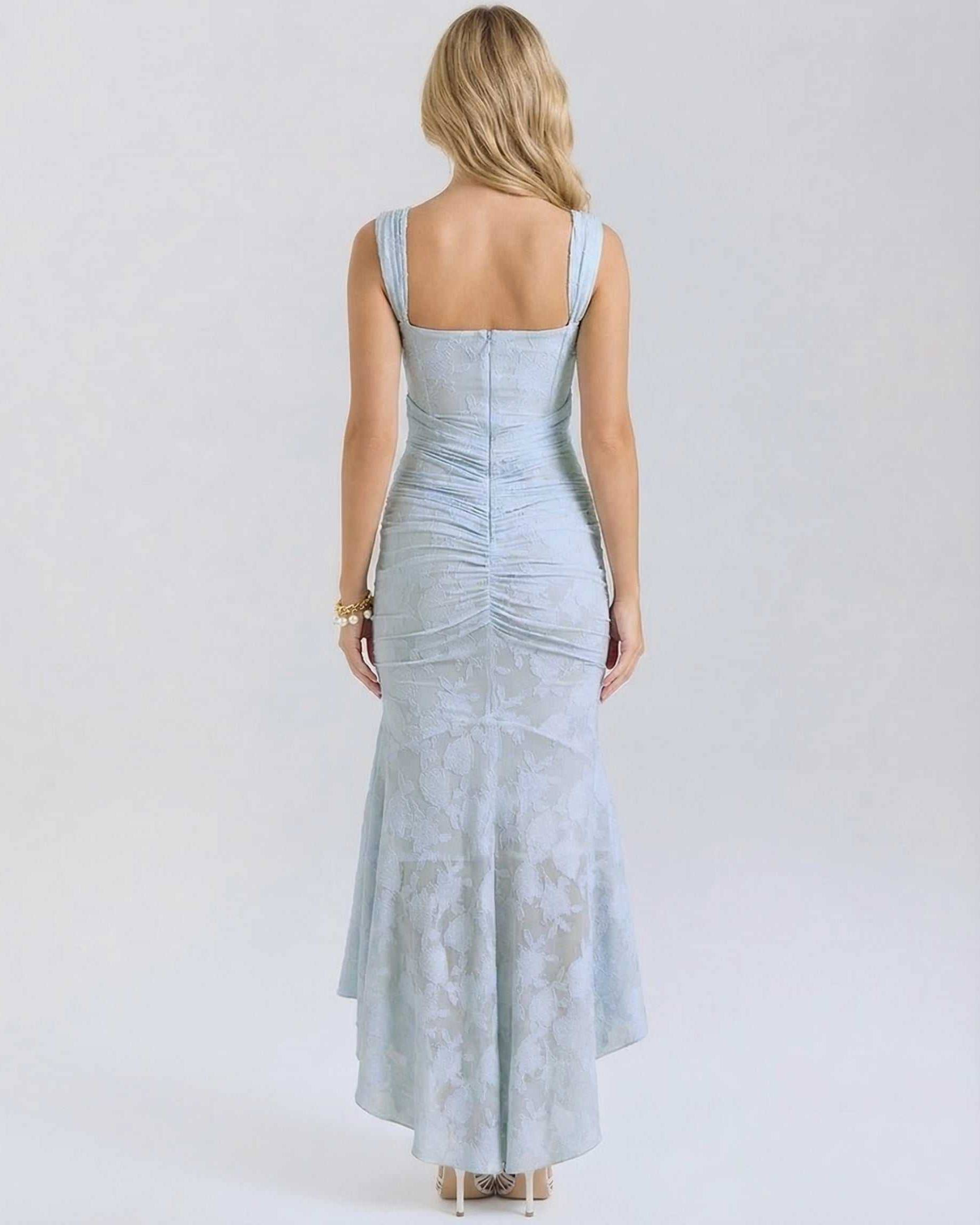 Celeste Maxi Dress by Lauven showcasing the elegant back view with a pleated design and fish tail hemline in pale blue.