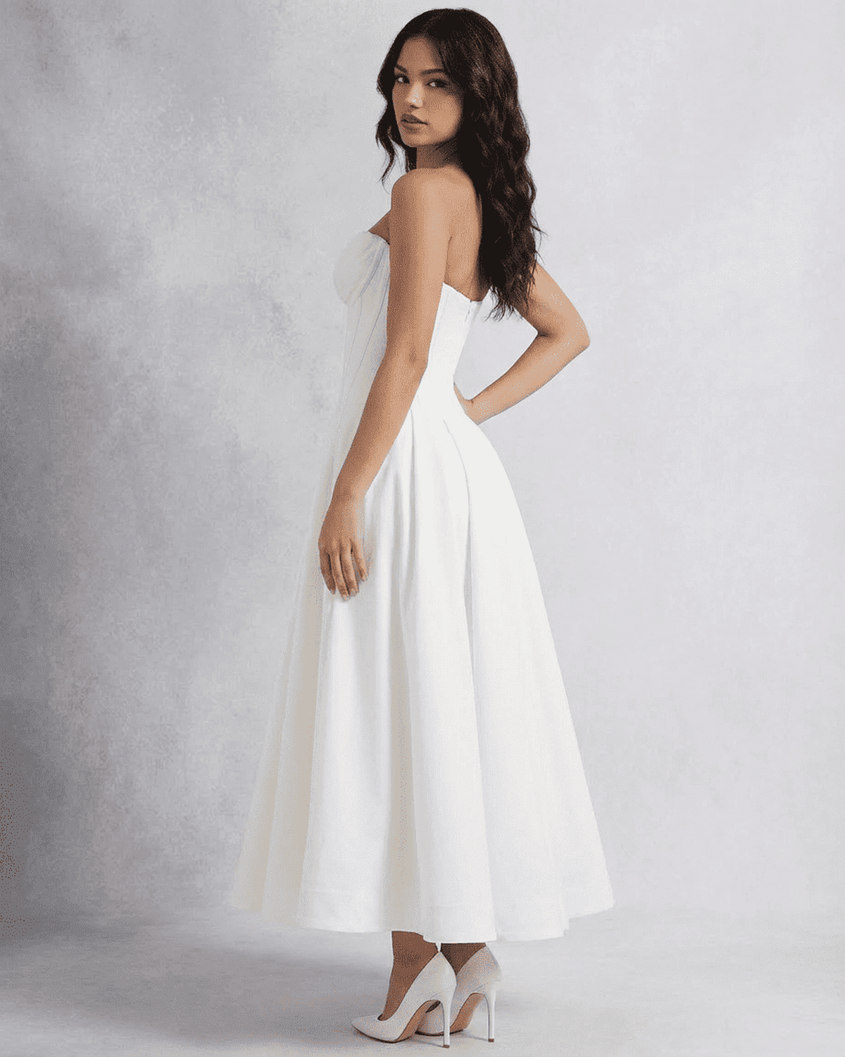 Celeste Midi Dress by Lauven, elegant strapless A-line dress showcased from the side view.