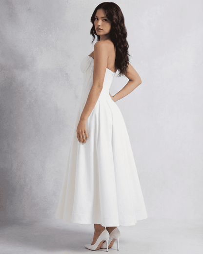 Celeste Midi Dress by Lauven, elegant strapless A-line dress showcased from the side view.