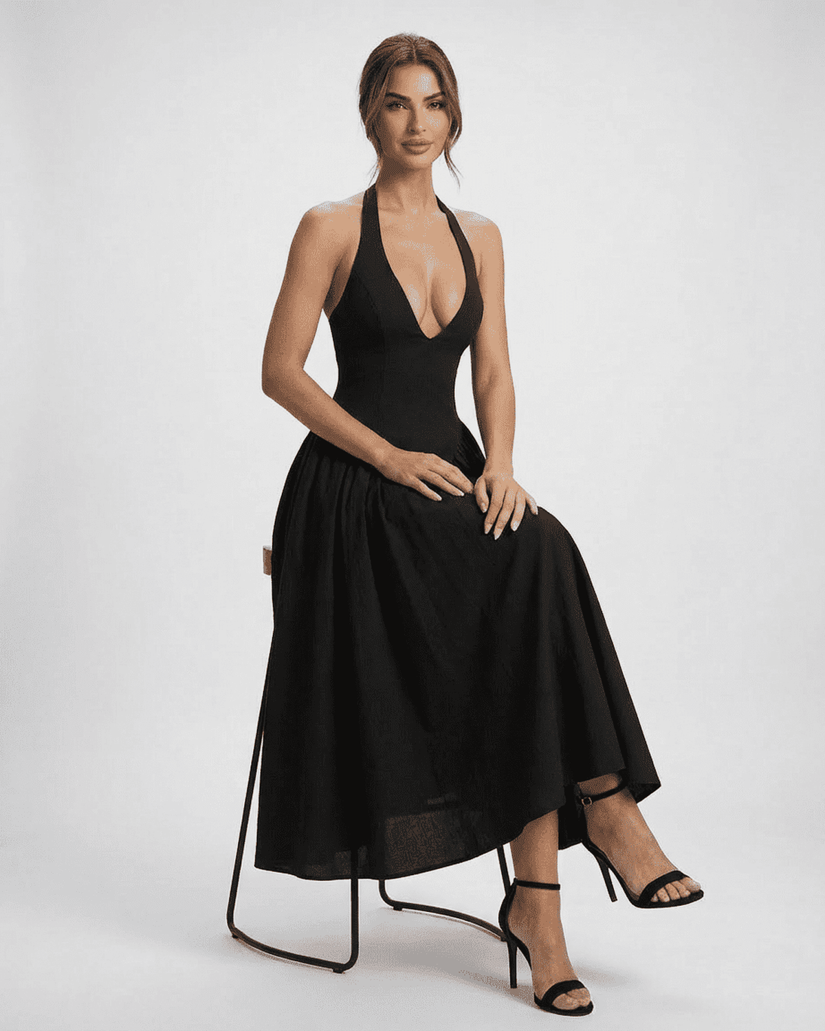 Celeste Midi Dress by Lauven, featuring a halter neck and backless design in a stunning black color.
