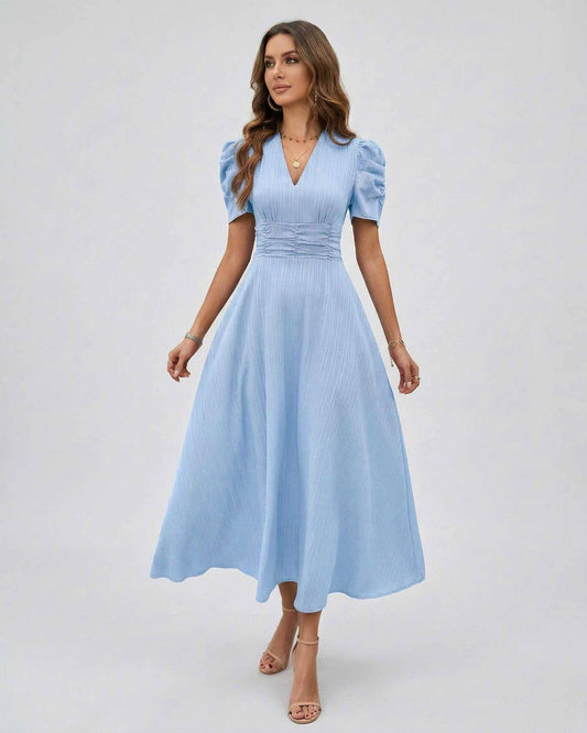 Celeste Midi Dress featuring light blue fabric, puff sleeves, flattering V-neck, and ruched waist by Lauven.