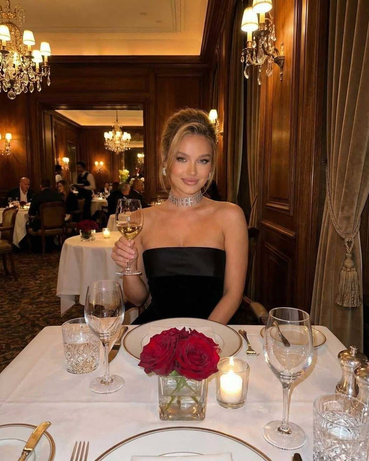 Celeste Mini Dress worn in an elegant setting, featuring a strapless velvet design and sophisticated style, by Lauven.