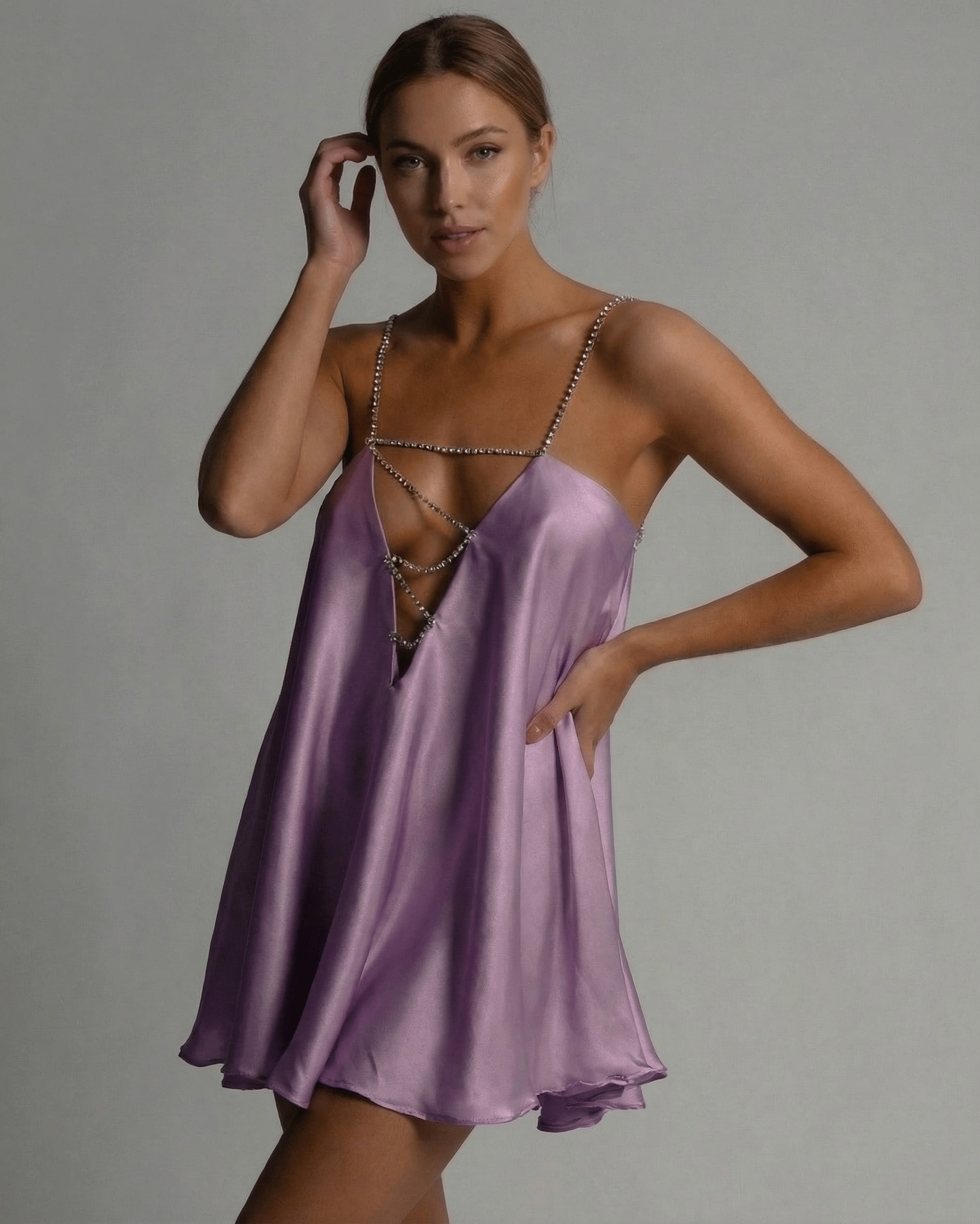 Celeste Mini Dress by Lauven, featuring a flared A-line silhouette in lavender satin with a V-neckline and beaded straps.