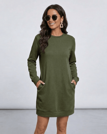 Model wearing Celeste Mini Dress by Lauven in olive green with pockets, showcasing casual style.