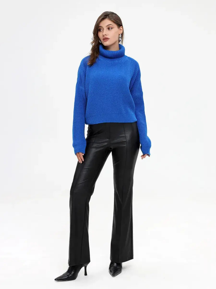 Celeste Sweater by Lauven, oversized blue knit with turtleneck, paired with black leather pants.