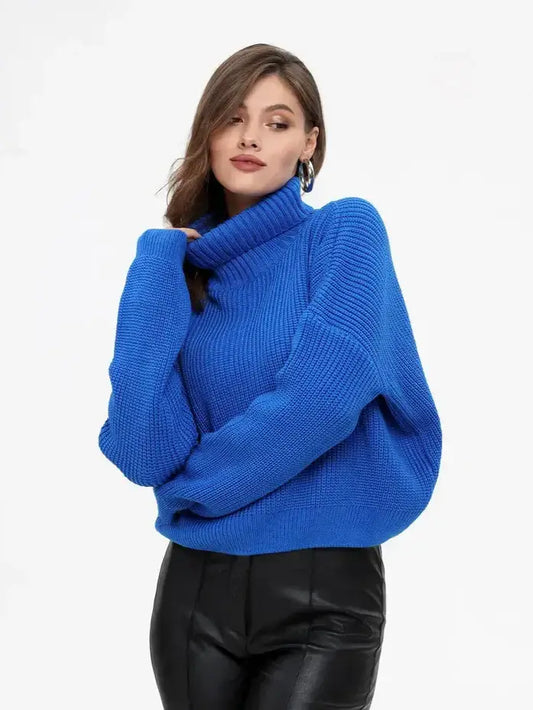 Celeste Sweater by Lauven, a chic oversized knit turtleneck in vibrant blue, ideal for layering.