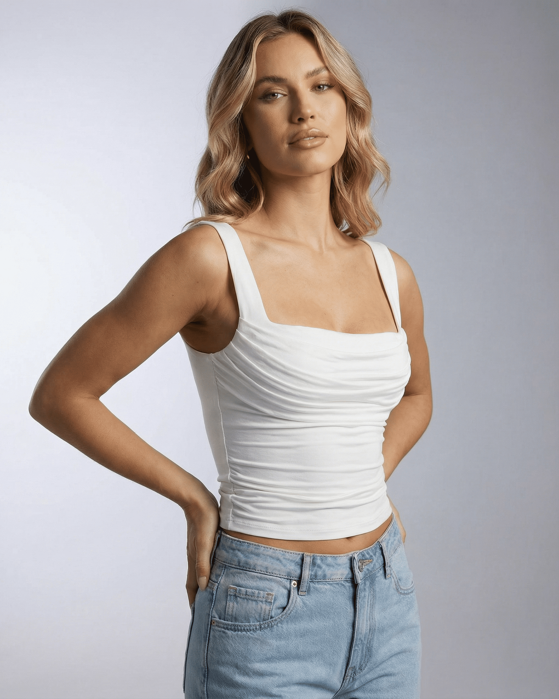 Celeste Top by Lauven, white draped square neck sleeveless top on model, modern elegance and everyday styling.