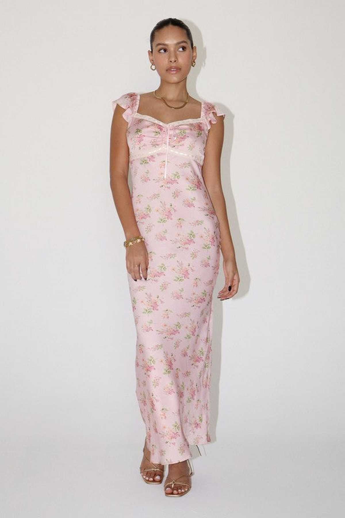 Celeste Women's Dress featuring pink floral satin fabric, flutter sleeves, and a flattering maxi silhouette, perfect for summer events.