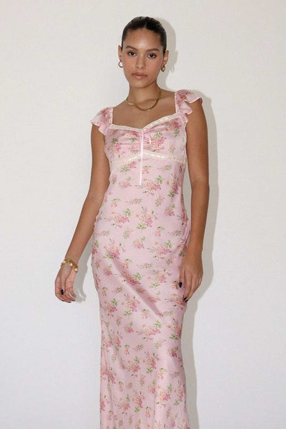 Celeste Women's dress featuring pink floral prints, flutter sleeves, and a gathered bustline, perfect for weddings and special occasions.