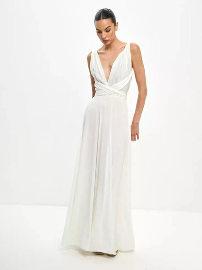 Elegant woman in a Celeste Wrap Maxi Dress with draped V-neck and convertible tie detail, showcasing a flowing A-line silhouette.